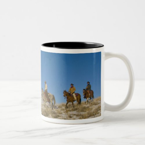 Cowboys on Ridge riding Horse through the Snow Two_Tone Coffee Mug