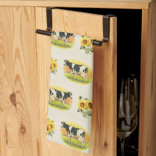 Cows and sunflowers on folded linen texture kitchen towel