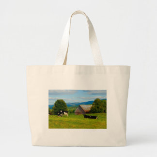 Cows in a field large tote bag