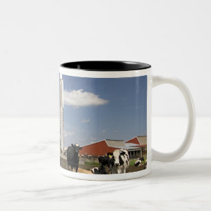 Cows in front of a red barn and silo on a farm Two-Tone coffee mug