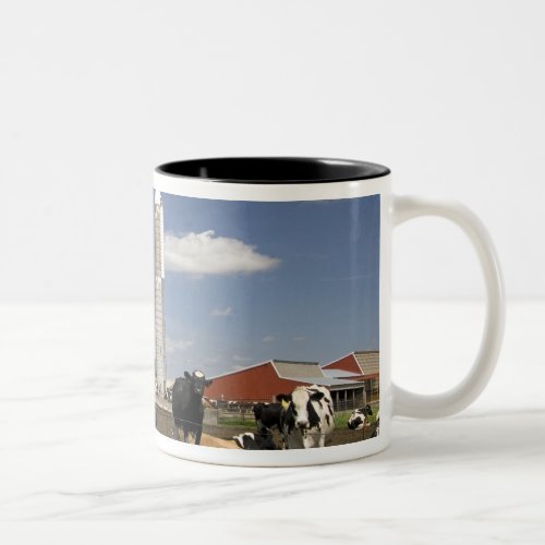 Cows in front of a red barn and silo on a farm Two_Tone coffee mug