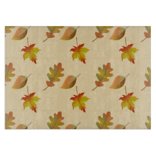 Cozy autumn maple leaves oak leaves cutting board