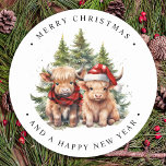Cozy Highland Cow Farm Animals Merry Christmas  Classic Round Sticker<br><div class="desc">Looking for the cutest Christmas cards of the season! Our Highland Cow duo featuring two holiday calves are sure to bring a smile to your loved ones' faces. The design is adorable with the calves wearing a Santa hat and a plaid winter scarf, surrounded by trees and a cozy winter...</div>