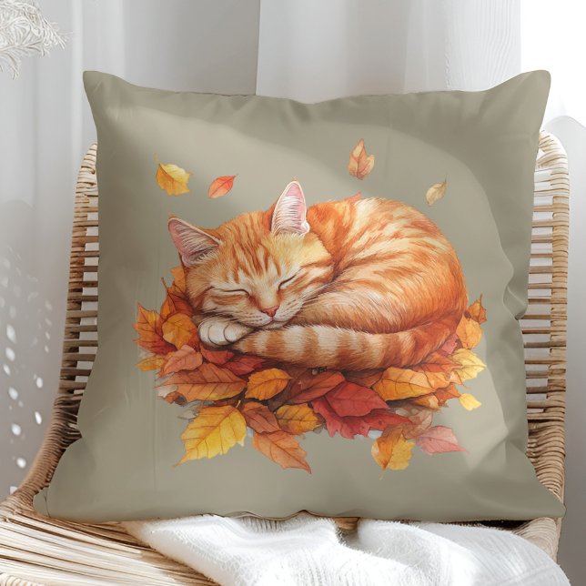 Cozy Sleeping Ginger Cat Olive Pillow  (Cozy Sleeping Ginger Cat Terracotta Pillow in a sunny boho rattan chair.)