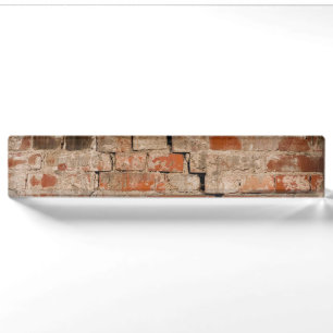 Cracked brick wall nameplate