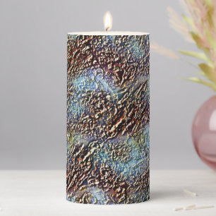 Cracked texture, caramel brown to dirty light cyan pillar candle