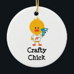 Crafty Chick Ornament<br><div class="desc">If you're handy with a glue gun and you love crafts, you'll love this cute chick wearing a tee with a pink flower and holding a glue gun on Crafty Chick t shirts, tees, stationery and more apparel and gear. Click here to see our complete line of cute Chrissy H....</div>