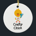 Crafty Chick Ornament<br><div class="desc">If you're handy with a glue gun and you love crafts, you'll love this cute chick wearing a tee with a pink flower and holding a glue gun on Crafty Chick t shirts, tees, stationery and more apparel and gear. Click here to see our complete line of cute Chrissy H....</div>