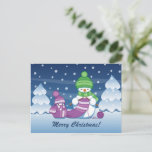 Crafty Snowman Knitting Scarf Holiday Postcard<br><div class="desc">Vector illustration of two adorable cartoon snowmen dressed in knitted hats and scarves. The big crafty snowman is knitting an oversized scarf for the little one. The scarf is already wrapped several times around the cute little snowman.</div>
