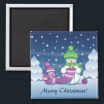 Crafty Snowman Knitting Scarf Magnet<br><div class="desc">Vector illustration of two adorable cartoon snowmen dressed in knitted hats and scarves. The big crafty snowman is knitting an oversized scarf for the little one. The scarf is already wrapped several times around the cute little snowman.</div>