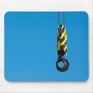 Crane hook with yellow and black stripes hanging mouse pad
