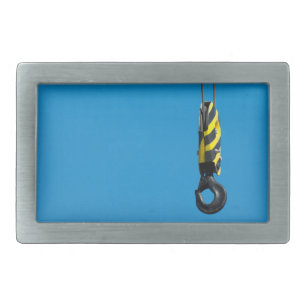 Crane hook with yellow and black stripes hanging rectangular belt buckle