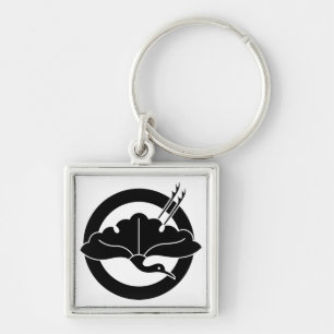 Crane-shaped ginkgo leaf on circle keychain