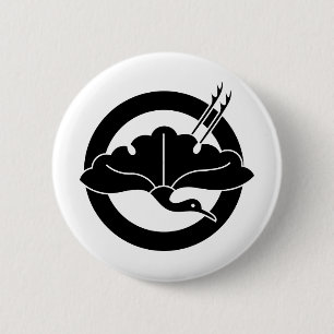 Crane-shaped ginkgo leaf on circle pinback button