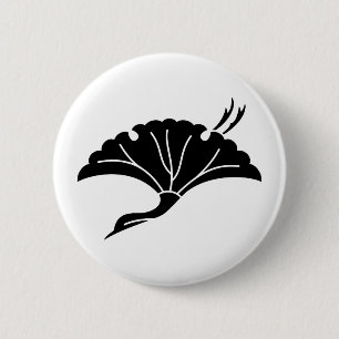 Crane-shaped ginkgo leaf pinback button