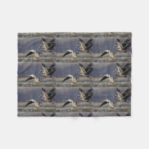 cranes in flight fleece blanket