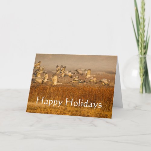 Cranes over golden field Happy Holidays Holiday Card