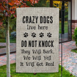 Crazy Dogs Live Here Do Not Knock Rustic Funny Dog Garden Flag<br><div class="desc">Welcome guests with this funny dog lover garden flag ! 
"Crazy dogs live here, , 
DO NOT KNOCK
They Will Bark,  
We Will Yell, 
It Will Get Real, 
Rustic natural faux jute and black design with paw prints. 
COPYRIGHT © 2020 Judy Burrows,  Black Dog Art - All Rights Reserved.</div>