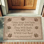Crazy Dogs Live Here Funny Pet Fiber Doormat<br><div class="desc">Welcome (or warn) guests with this playful doormat that reads, "Crazy Dogs Live Here. Do Not Knock. They Will Bark, We Will Yell, It Will Get Real." Featuring paw print accents and a customizable family name, this mat is perfect for pet-loving households. Ideal for new homeowners, dog owners, or as...</div>