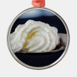 cream on a spoon macro concept metal ornament
