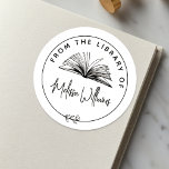 Create your own 'From the Library of' Bookplate<br><div class="desc">Elevate your book collection with our chic bookplate, perfect for book lovers, teachers, and librarians. This elegant bookplate features a hand-drawn open book illustration surrounded by a circular border with a botanical leaf motif, creating a timeless design. The circular frame includes "From the library of" in curved text at the...</div>