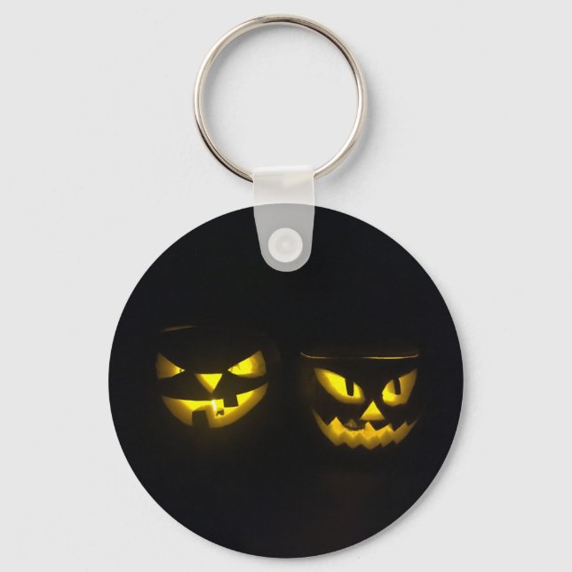 Creepy yellow glow spooky pumpkin faces on black keychain (Front)