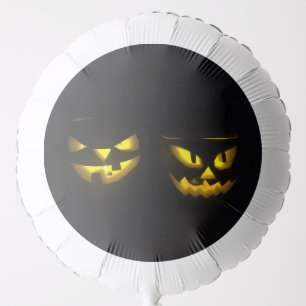 Creepy Yellow Pumpkin Face on black Balloon