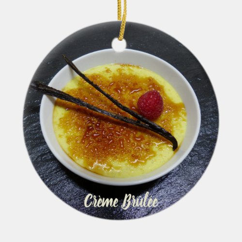 Creme brulee on slate with raspberry and vanilla ceramic ornament