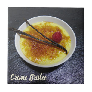 Creme brulee on slate with raspberry and vanilla ceramic tile