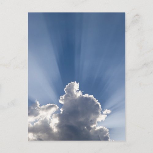 Crepuscular or Gods rays streak past cloud Postcard
