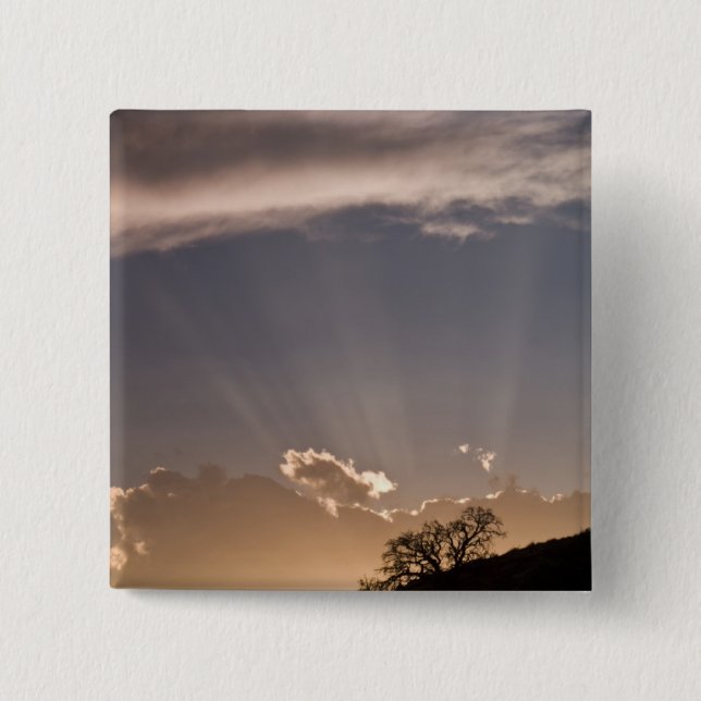 Crepuscular rays radiate across the sky at pinback button (Front)