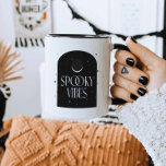 Crescent Moon - Spooky Vibes Halloween Coffee Mug<br><div class="desc">Check out this crescent moon Halloween mug featuring the funny quote "Spooky Vibes" in white lettering. Illustrated with a modern moon and stars image. The coffee mug features a black two-toned design. This is perfect as a fun Halloween gift or as an office mug.</div>