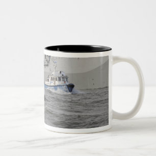 Crews from the coast guard and police departmen Two-Tone coffee mug