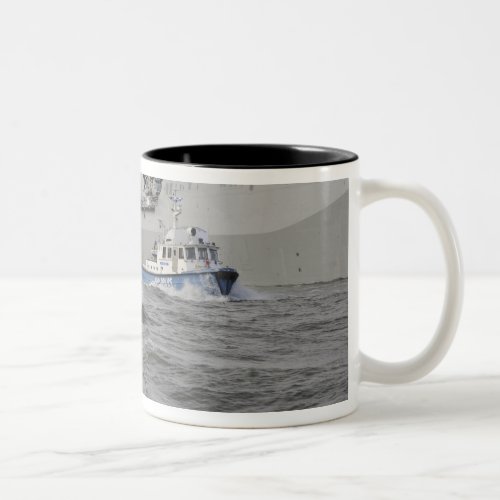 Crews from the coast guard and police departmen Two_Tone coffee mug