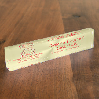 Crimson red classic luxury sports car logo on gold desk name plate