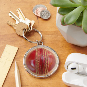 Crimson Stitch Focus: Close-Up of Cricket's Heart Keychain