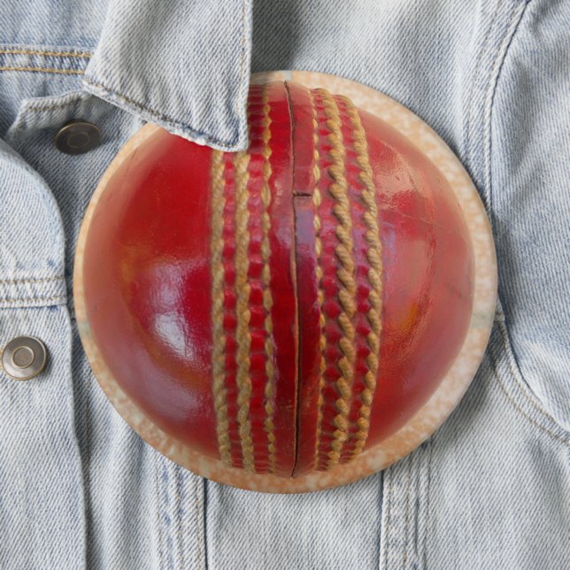 Crimson Stitch Focus: Close-Up of Cricket's Heart Pinback Button (In Situ)
