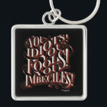 Cruella De Vil | You Idiots Keychain<br><div class="desc">This design features a Cruella De Vil phrase from the animated feature film 101 Dalmatians.</div>