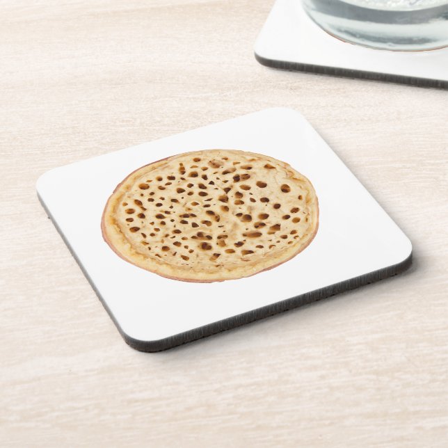 Crumpet on white beverage coaster (Left Side)