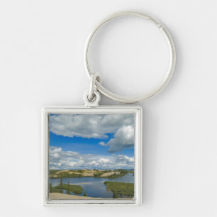 Cumulus clouds float above lakes, Northwest Keychain