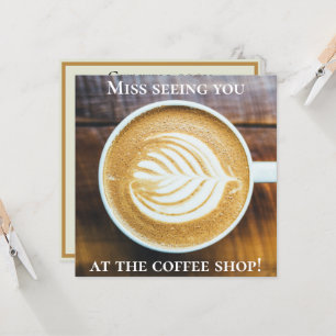 Cup of Coffee Latte with Leaf-Shape Foam on Wood Card