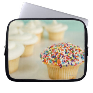 Cupcakes, focus on one in front with laptop sleeve