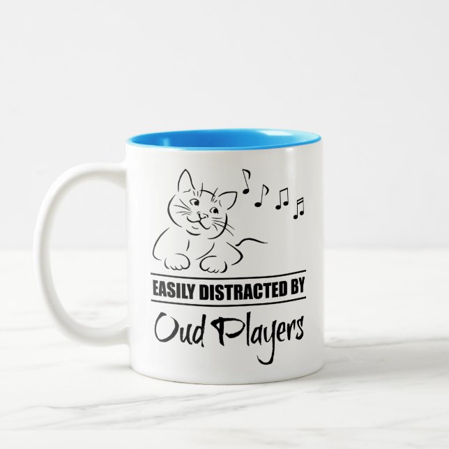 Curious Cat Easily Distracted by Oud Players Two-Tone Coffee Mug (Left)
