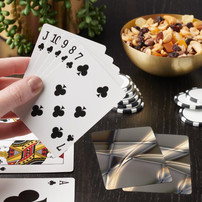 Curved golden strokes and twisted squares on sepia poker cards (In Situ)