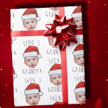 Custom Baby Face Santa Hat Christmas Photo Wrapping Paper<br><div class="desc">Funny Custom Baby Face Santa Hat Christmas Photo Wrapping Paper , Replace the face of this elf with your favorite photo (make sure to crop as much to the face as possible and use an app to remove the background) and personalize this funny Christmas Holiday Wrapping Paper with your kid,...</div>