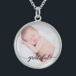 Custom, baby photo, "grateful" script sterling silver necklace<br><div class="desc">Set a favorite photo of your baby within this pendant. The word "grateful" in an elegant script is placed at the bottom to remind you of this special word and loved child. A wonderful gift.</div>