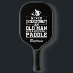 Custom Black Never Underestimate An Old Man With A Pickleball Paddle<br><div class="desc">This Pickleball paddle featuring a Pickleball player and "Never Underestimate An Old Man With A Pickleball Paddle" written in white font on black background is a perfect gift for a Pickleball lover. You can customize this design with your or your loved one's name, or remove the name by clicking "Personalize...</div>