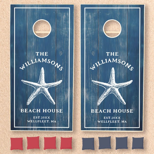 Custom Blue Coastal Starfish Beach House Cornhole Set (Two blue woodgrain cornhole boards feature a white starfish with custom text design)