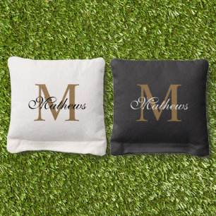 Custom Elegant Script Gold Monogram Black & White Cornhole Bags