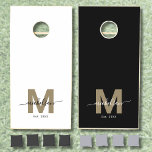 Custom Family Name Monogram Black Gold Cornhole Set<br><div class="desc">Create Your Own Custom Family Name Monogram Black Gold Cornhole Set. This elegant set brings sophistication to weddings and family gatherings, featuring a chic monogram with the family’s last name in graceful script and a gold-colored initial—flat and without shimmer—for a timeless look. One board has a black background with the...</div>